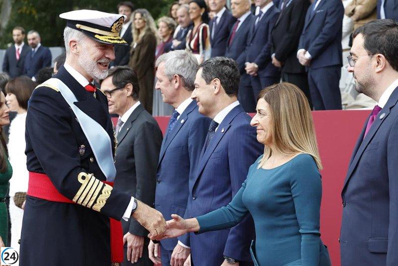 Buruaga participa en Madrid en el tributo a la bandera y el desfile militar por la Fiesta Nacional.
